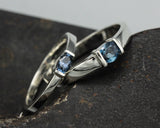 Wedding band set his and hers with blue sapphire gemstones