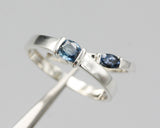 Wedding band set his and hers with blue sapphire gemstones