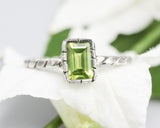 Rectangle Peridot gemstone ring in silver bezel setting with sterling silver twist design band