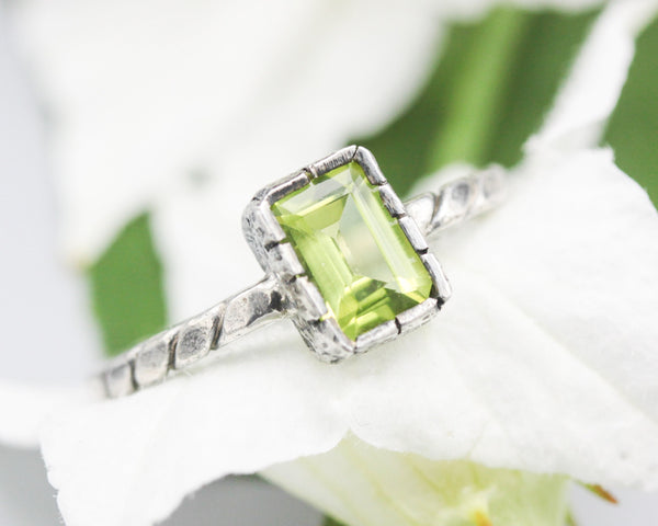 Rectangle Peridot gemstone ring in silver bezel setting with sterling silver twist design band