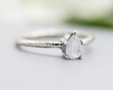 Teardrop faceted Moonstone ring in prongs setting with sterling silver oxidized texture band
