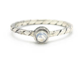 Round cabochon moonstone ring in bezel setting with sterling silver band