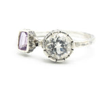 Round white topaz ring in silver bezel and amethyst on the side with sterling silver texture band