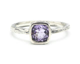 Amethyst gemstone ring in silver bezel setting with sterling silver band