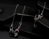 Black onyx pendant necklace with ruby and labradorite gemstone
