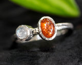 Sunstone ring in bezel setting with moonstone on sterling silver oxidized hammered texture band