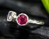 Red ruby ring with amethyst side set in silver bezel setting