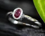 Ruby ring in oval cut with sterling silver twist design band
