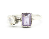 Amethyst ring in silver bezel setting with moonstone on the side set on sterling silver texture oxidized band