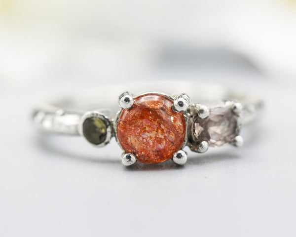 Sterling silver wedding ring with sunstone, pink tourmaline and green tourmaline gemstone in bezel and prongs setting