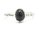 Black star diopside ring in silver bezel setting with hammer textured sterling silver band