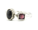 Oval black star diopside ring and garnet with sterling silver oxidized texture band