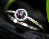 Round cut pink spinel ring in bezel setting with sterling silver texture band
