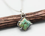 Green turquoise pendant necklace in silver bezel and prongs setting