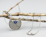 Round Blue kyanite gemstone pendant necklace with silver crescent moon shape on sterling silver chain