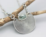 Crescent moon necklace with oval mint kyanite in silver bezel setting