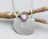 Crescent moon necklace with cushion pink sapphire in silver bezel setting