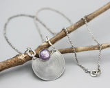 Crescent moon necklace with cushion pink sapphire in silver bezel setting