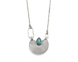Crescent moon necklace with teardrop Paraiba Kyanite in silver bezel setting