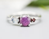 Sterling silver wedding ring with pink sapphire, moonstone, garnet gemstone in bezel and prongs setting