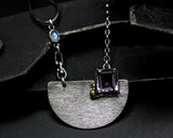 Princess cut amethyst pendant necklace in silver bezel and prongs setting with silver semi-circle shape on sterling silver chain