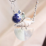 Silver fan pendant necklace with Seashell, mother of pearls, lapis lazuli and blue kyanite gemstone in silver bezel and prongs setting