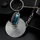 Rectangle cabochon labradorite pendant necklace with silver circle in spiral design on sterling silver chain