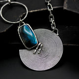 Rectangle cabochon labradorite pendant necklace with silver circle in spiral design on sterling silver chain