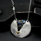 Sterling silver circle shape pendant necklace with moonstone, iolite and black star diposide on sterling silver chain