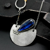 Teardrop Labradorite pendant necklace with silver semi-circle in matte finish brush texture on sterling silver chain