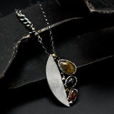 Teardrop Rutilated quartz pendant necklace, orange kyanite and black star diposide with silver semi-oval on sterling silver chain