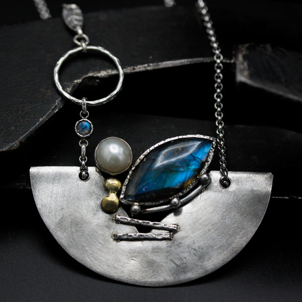 Marquise labradorite pendant necklace in silver bezel setting and freshwater pearls with silver fan shape on silver chain