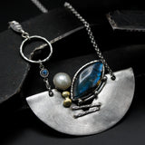 Marquise labradorite pendant necklace in silver bezel setting and freshwater pearls with silver fan shape on silver chain