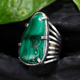 Malachite gemstone ring in silver bezel and prongs setting with skeleton hammered texture band