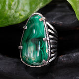 Malachite gemstone ring in silver bezel and prongs setting with skeleton hammered texture band