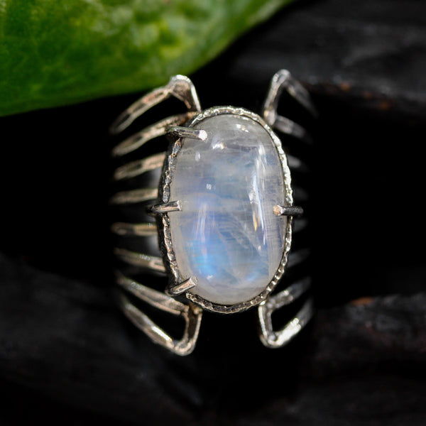 Oval cabochon Moonstone ring in silver bezel and prongs setting with sterling silver skeleton multi wrap band