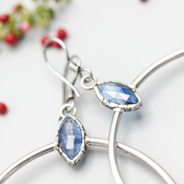Blue kyanite earrings in silver bezel setting with silver circle loop on hooks style