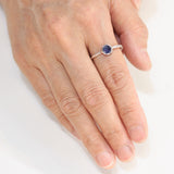 Round blue kyanite ring in silver bezel setting with sterling silver texture band