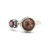 Round faceted Moss agate ring in silver bezel setting with garnet on oxidized sterling silver band