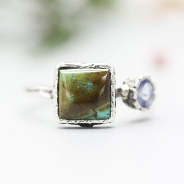 Square turquoise ring in silver bezel setting with tiny tanzanite on the side with sterling silver hammer texture band