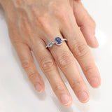 Oval faceted Blue Kyanite ring in silver bezel setting with round blue topaz on sterling silver hard texture band