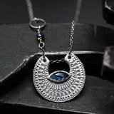 Crescent moon necklace with marquise blue kyanite in silver bezel setting