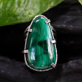 Malachite gemstone ring in silver bezel and prongs setting with skeleton hammered texture band