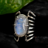 Oval cabochon Moonstone ring in silver bezel and prongs setting with sterling silver skeleton multi wrap band