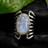 Oval cabochon Moonstone ring in silver bezel and prongs setting with sterling silver skeleton multi wrap band