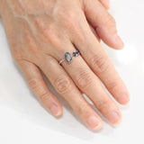 Oval Rough diamond ring in silver bezel setting and round faceted blue sapphire on the side with sterling silver band