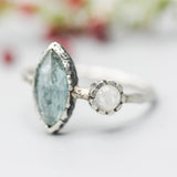 Marquise faceted Paraiba Kyanite ring in silver bezel setting with round Moonstone on sterling silver hard texture band