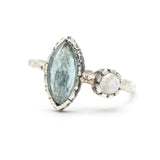 Marquise faceted Paraiba Kyanite ring in silver bezel setting with round Moonstone on sterling silver hard texture band