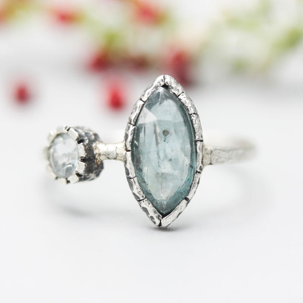 Marquise faceted Paraiba Kyanite ring in silver bezel setting with round blue topaz on sterling silver hard texture band
