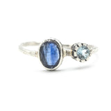 Oval faceted Blue Kyanite ring in silver bezel setting with round blue topaz on sterling silver hard texture band